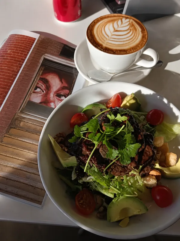 Coffee and a fresh salad in the afternoon light