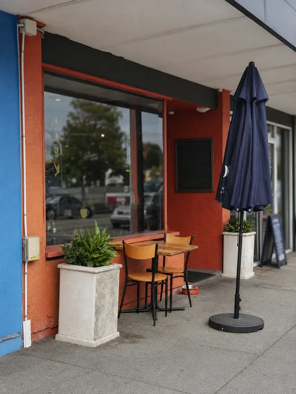 Sweet Lili’s street-front seating and open sign