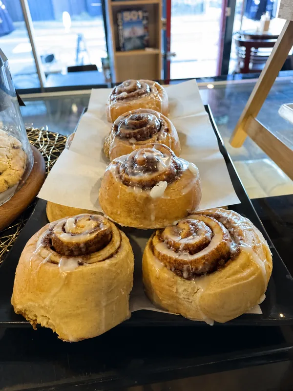 Cinnamon scrolls displayed at the cafe counter